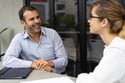 cheerful-mid-adult-hr-manager-having-interview-with-candidate